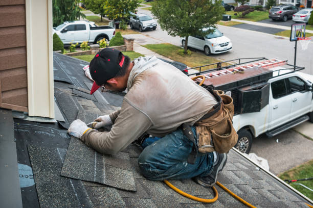 Professional Roofing technician working in Bayville, NY